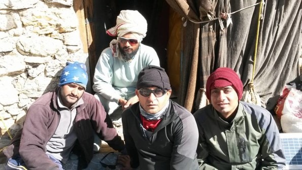 Starting from Left: Our porter Akhil, Manmohan and me with Mauni baba at the Back.